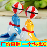 上链发条小海豚顶球儿童玩具360度旋转行走杂技地摊货源热卖批发