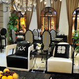 后现代烤漆时尚简约牛青皮沙发loft客厅复古咖啡椅单人沙发黑白色